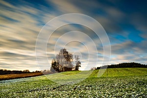 Early winter long exposure field landscape