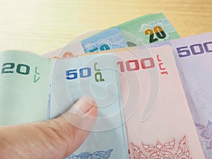 Earn and save money, pile of banknotes in hand