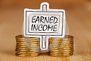 Earned income banner with money. photo