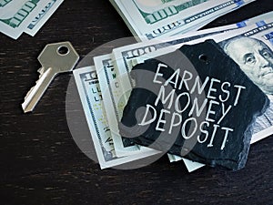 Earnest Money Deposit label and stack of money