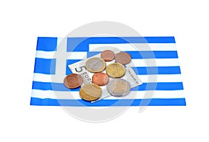 Earning in Greece concept with money and flag