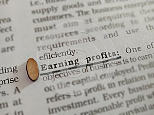 earning profits business related terminology displayed on paper page