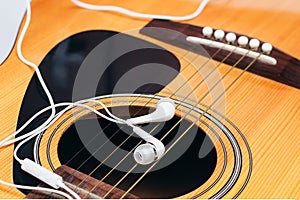 Earphone on guitar,selective focus