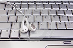 Earphone on keyboard photo