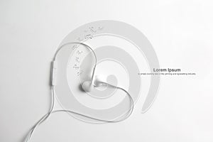 Earphone in shape of heart. on white background. photo