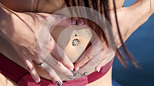 Earring in the navel at the beautiful girl - party and bachelorette party