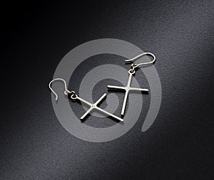 Earrings with diamonds on black background