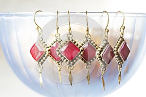 Earrings with gemstone mineral in Indian boho style decorative design