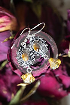 Earrings with gemstone mineral in Indian boho style decorative design