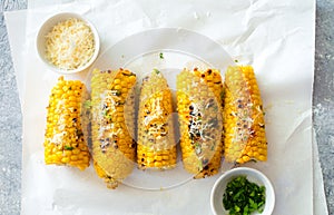 Ears of corn baked with herbs and parmesan cheese