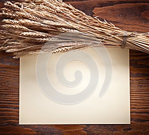 Ears of wheat on old wood.