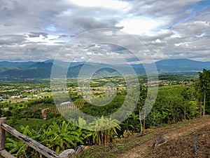 Earth building yun lai view point sun comes through mountain rain forest north pai chiang mai thailand green trees asia photo