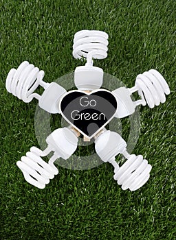 Earth Day, April 22, concept with energy saving light bulbs.