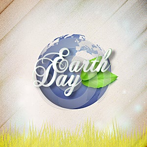 Earth Day background with the words, world globe and green leaves. Wooden texture. Vector illustration