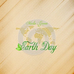 Earth Day background with the words, world map and green leaves. Wooden texture. Vector illustration