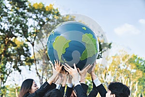 Earth day concept with big Earth globe held by hand up in sky. Gyre
