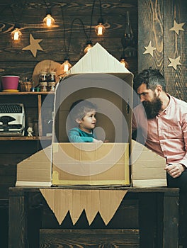 Earth day concept. earth day holiday with father and small kid in paper rocket