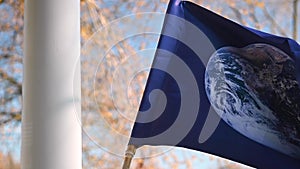 Earth Day flag waving in the wind