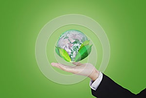 Earth day, Protect the world with environment and Eco-friendly business. Businessman hand holding globe with leaves. Element of th