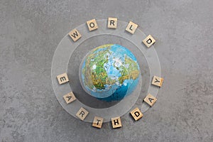 Earth day word with earth globe on grey background, earth day concept