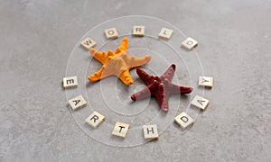 Earth day word with starfish on grey background, earth day concept