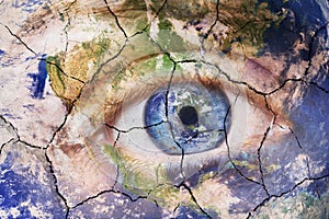 Earth extinction concept. Close up image of woman face with earth painted cracked texture with iris earth. Creative