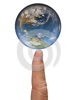 The Earth globe balances on the tip of a index finger isolated on white background. Evironmental concept. Close up image. Elements