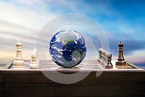 Earth globe on a chessboard. Strategy, world politics concept photo