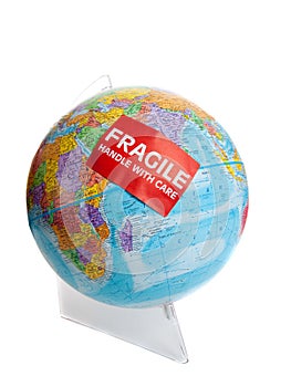 Earth globe with a fragile sticker