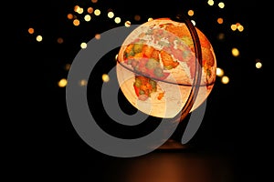 Earth globe glowing in dark starry sky