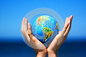 Earth globe in hands. Conceptual image