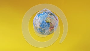 Earth globe in plastic. Ecology problem, pollution with plastic. School class of geography. Earth day