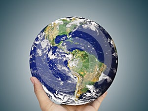 Earth globe, world in hand