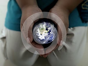 Earth in hand.