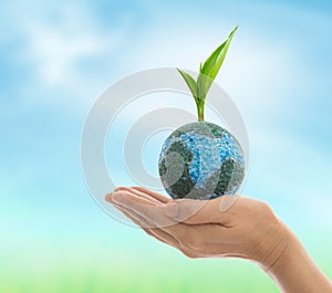 Earth in hand isolated on white