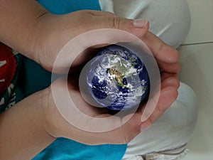 Earth in hands.