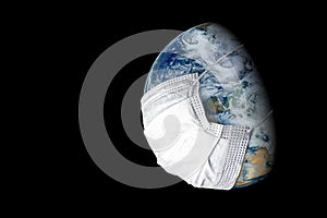 Earth in medical mask isolated on black background, concept of coronavirus in world and COVID-19 pandemic. Globe with protect from