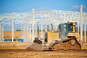 earth mover bulldozer at construction site during building