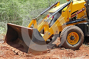 Earth mover clearing forest photo