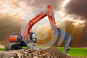 Earth mover and excavator at work