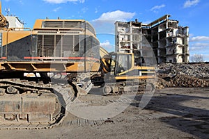 Earth mover and industrial ruins