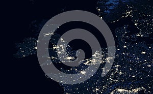 Earth at night, view of city lights showing human activity in UK, Netherlands and Belgium from space