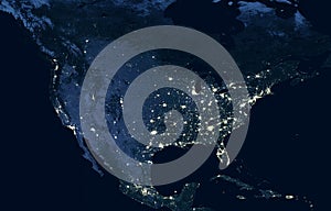 Earth at night, view of city lights showing human activity in USA from space. North America on world dark map on global satellite