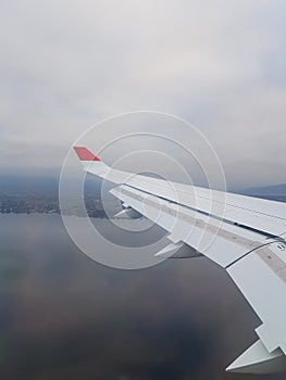 Earth, ocean and plane wing