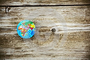 Earth planet model on wooden background