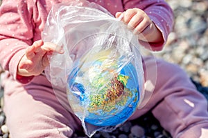 The Earth in a plastic bag. World Environment Day concept.