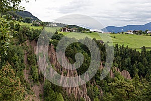 Earth pyramids in front of a scenic landscape of Alto Adige, Northern Italy