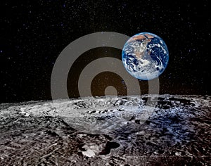 Earth rises above lunar horizon. photo