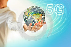 Earth from Space in hands, globe in hands. 5G k Internet mobile wireless concept. Elements of this image furnished by