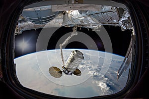 Earth in spaceship window porthole. Dust storm clouds